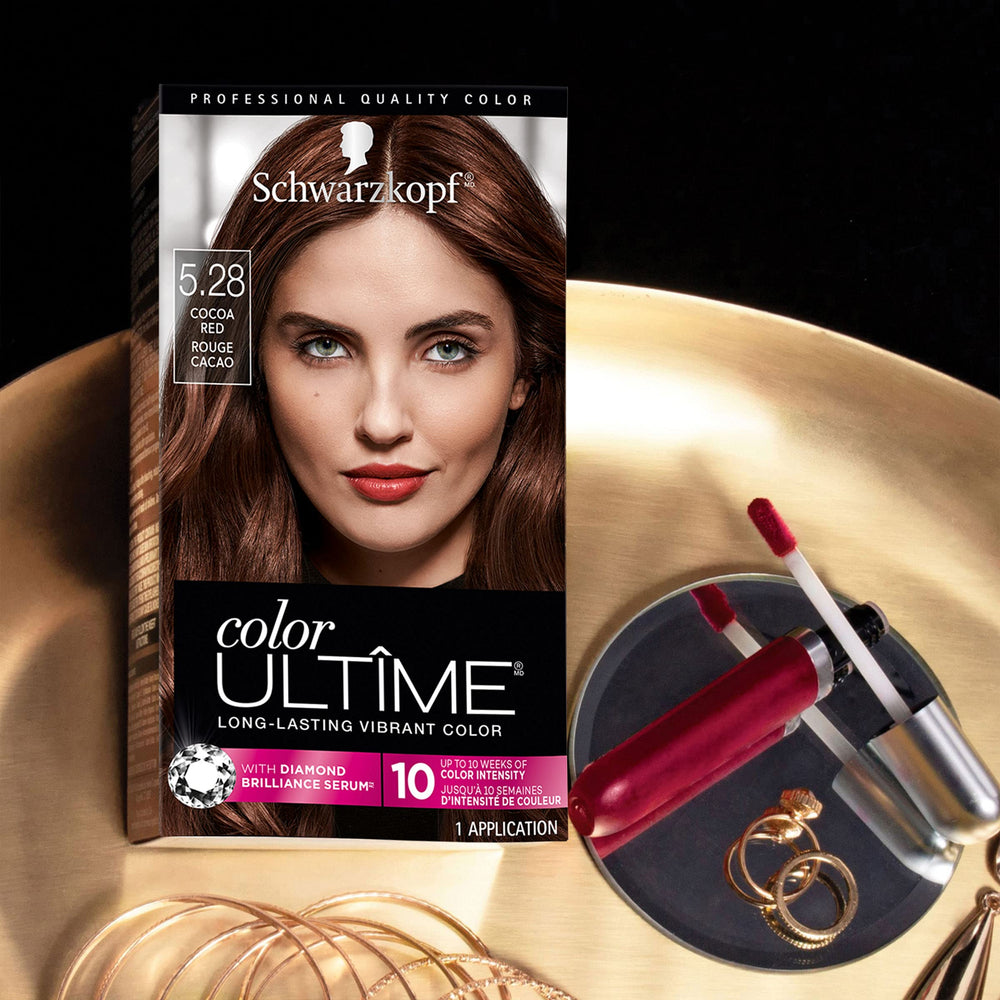 Schwarzkopf Color Ultime color swatch on skin demonstrates rich cocoa red shade.