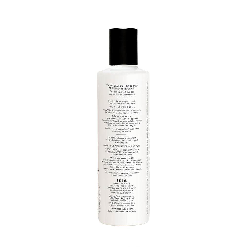 SEEN conditioner bottle pour highlights detangling softness with frizz-reduction.