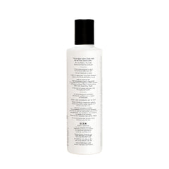 SEEN conditioner bottle pour highlights detangling softness with frizz-reduction.