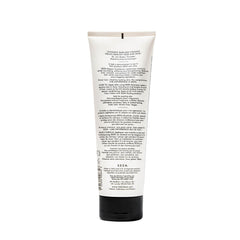  SEEN Deeper Conditioner on hair swatch showing frizz control and softness.