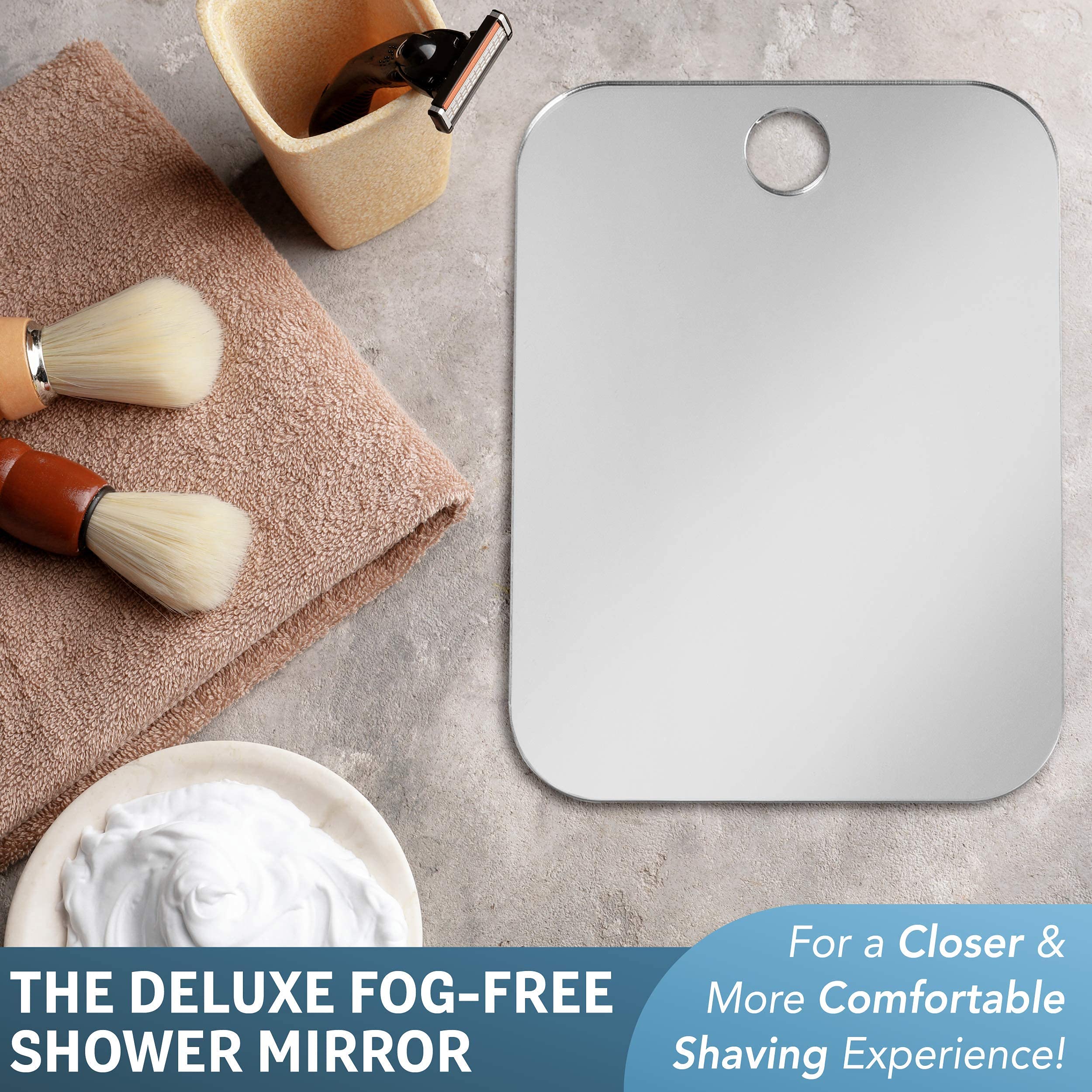 Removable adhesive wall hook secures the mirror on tile or stone.