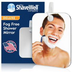 The Shave Well Deluxe fogless mirror mounted on a wall hook for quick grooming.