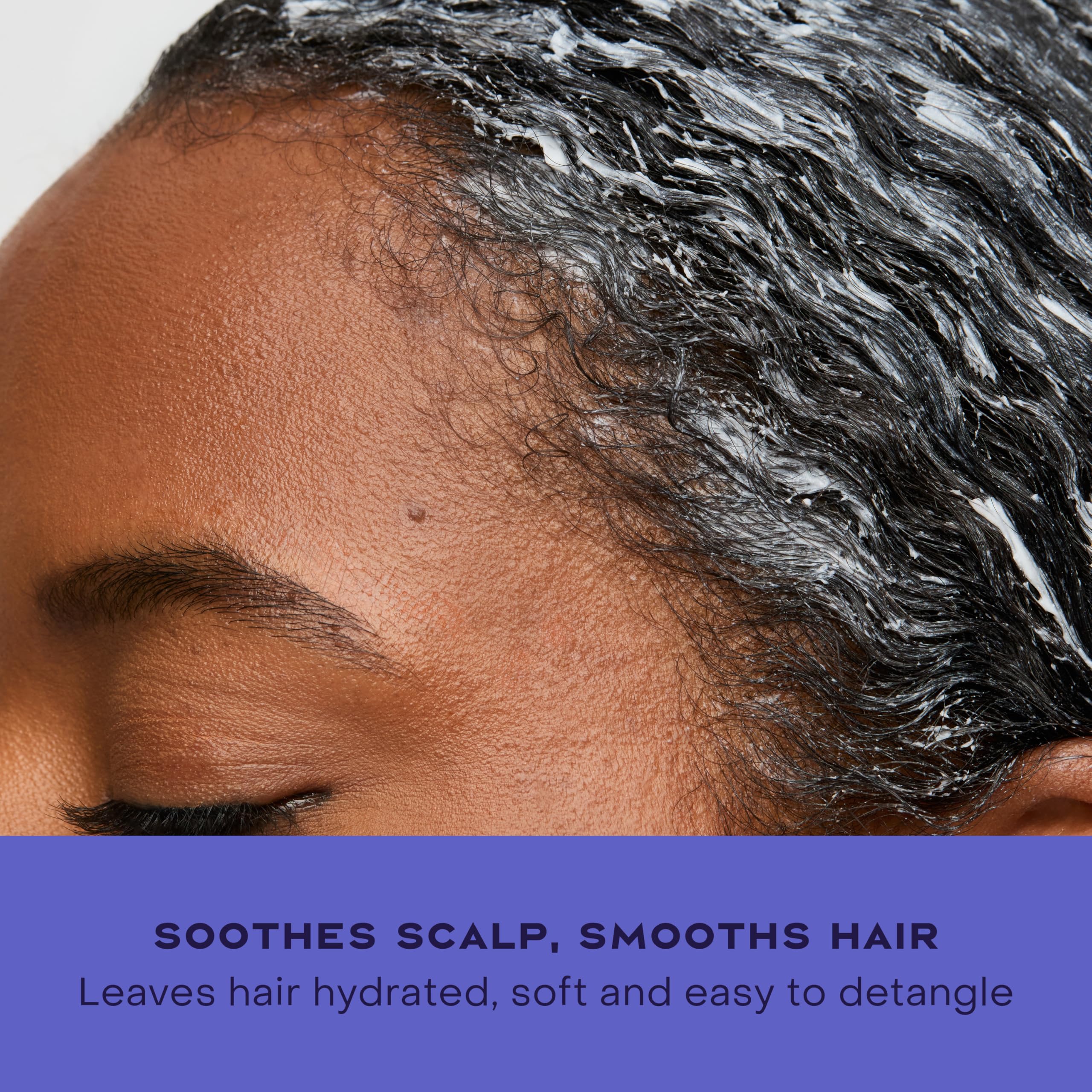 SheaMoisture conditioner being applied in shower to soothe itchy scalp