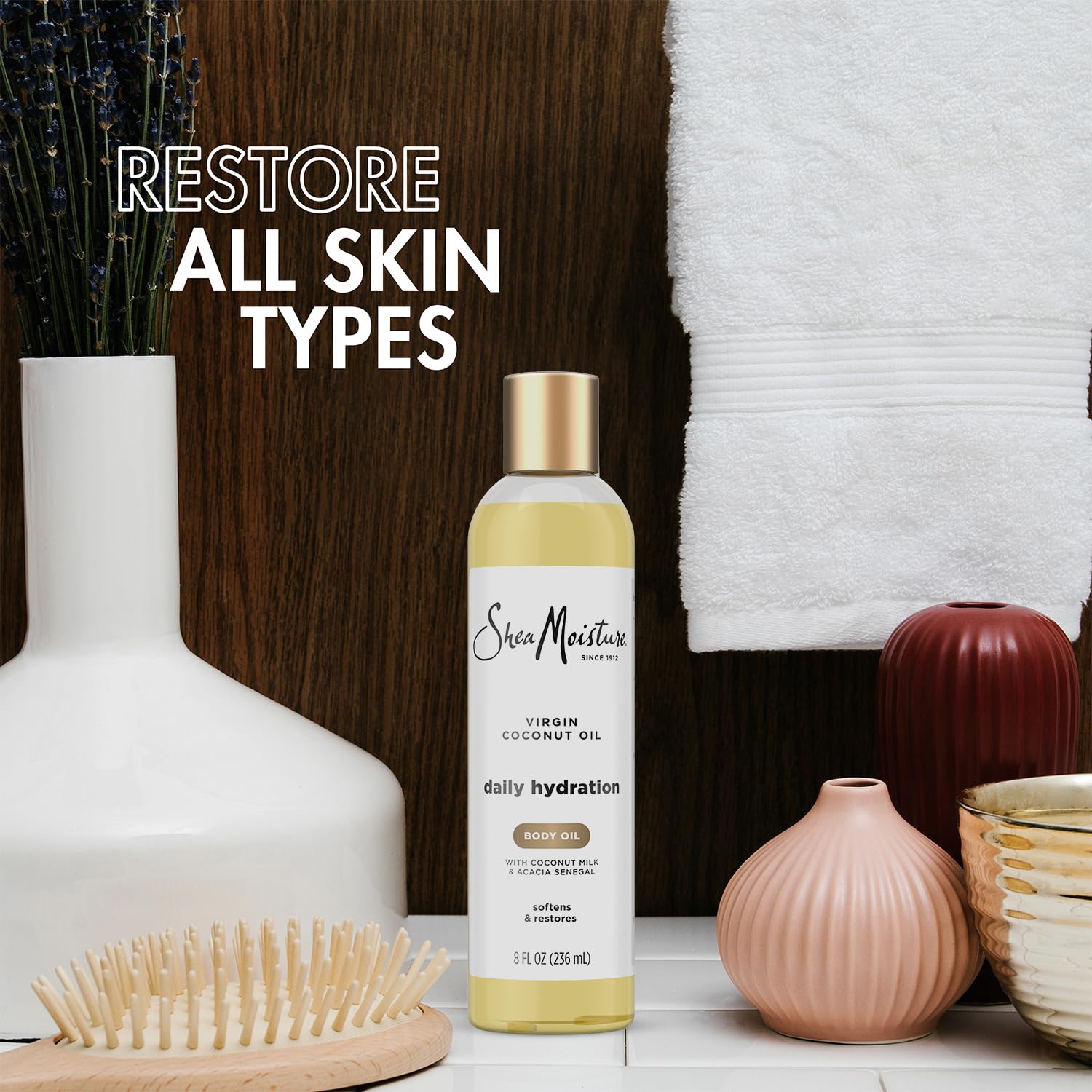 SheaMoisture body oil texture spreading on skin for a non-greasy finish