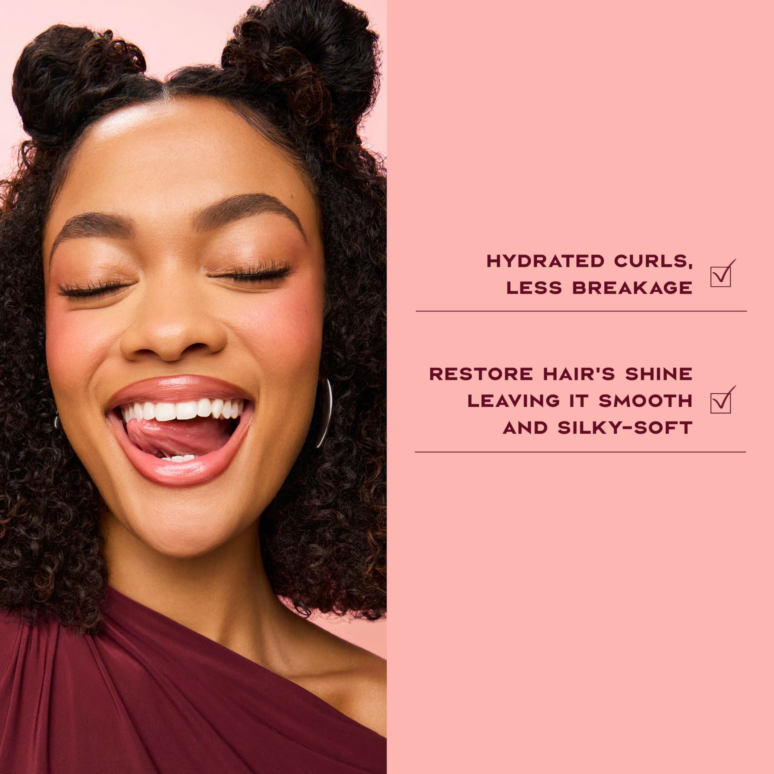 SheaMoisture Deep-conditioning masque gloss on hair strands suggests intense hydration.