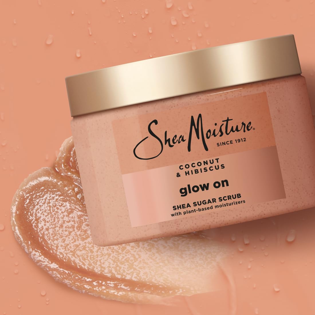 Bottle of SheaMoisture Glowing Radiance Scrub on wood background for natural care