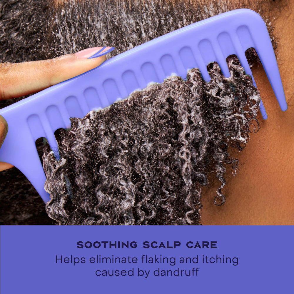 SheaMoisture hair after conditioner image shows smoothness and natural shine post rinse.