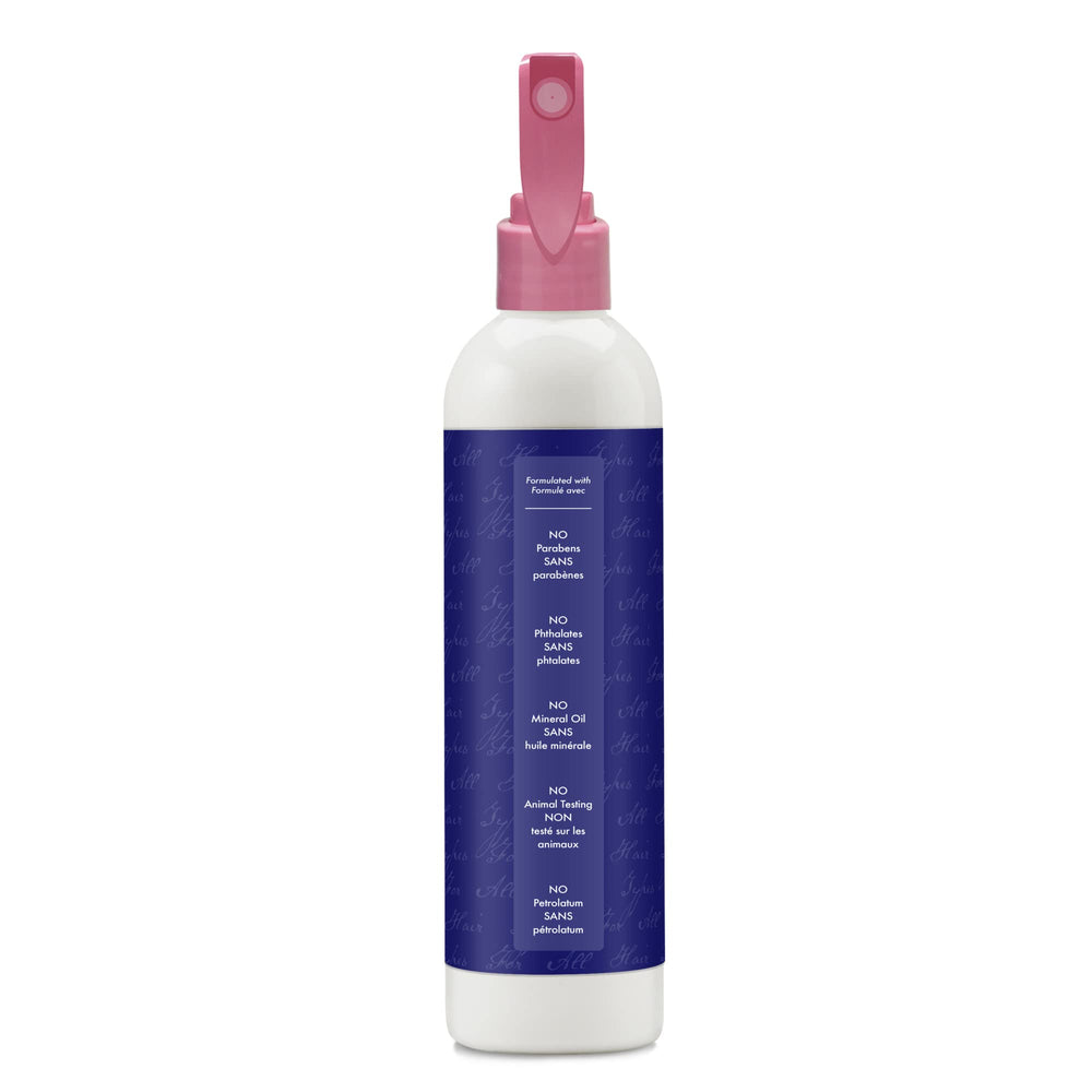 Applying SheaMoisture leave-in on wet hair for detangling and manageability.