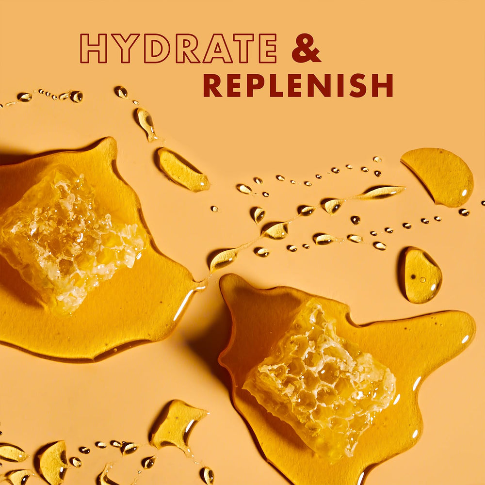 Applying Masque to wet hair with a wide-tooth comb for conditioning.
