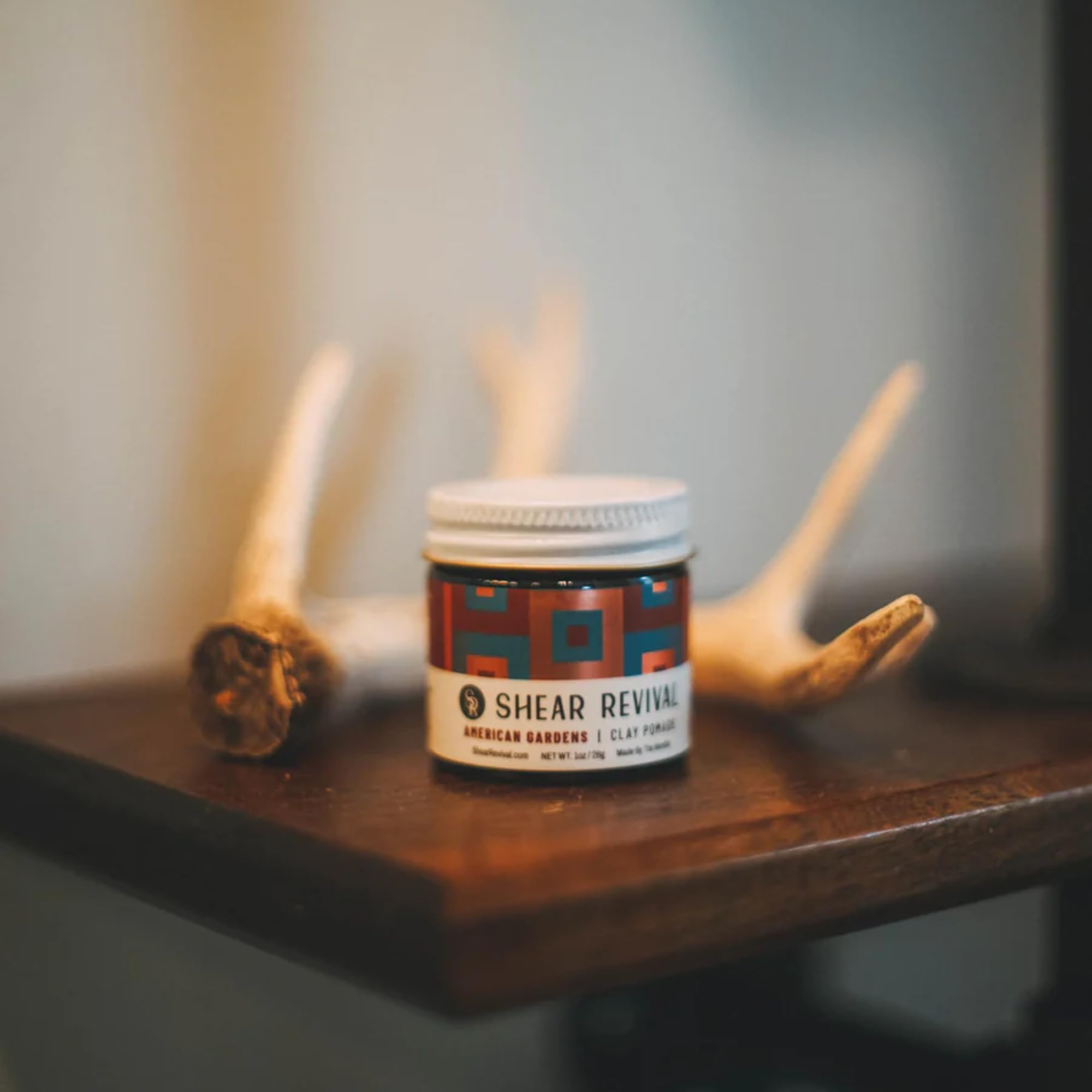 Shear Revival American Gardens clay pomade on textured hair illustrating versatile styling
