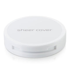 Sheer Cover Studio open compact with brush for quick on-the-go touch-ups.