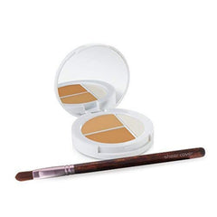 Sheer Cover Studio compact close-up shows two concealers blending for natural coverage.