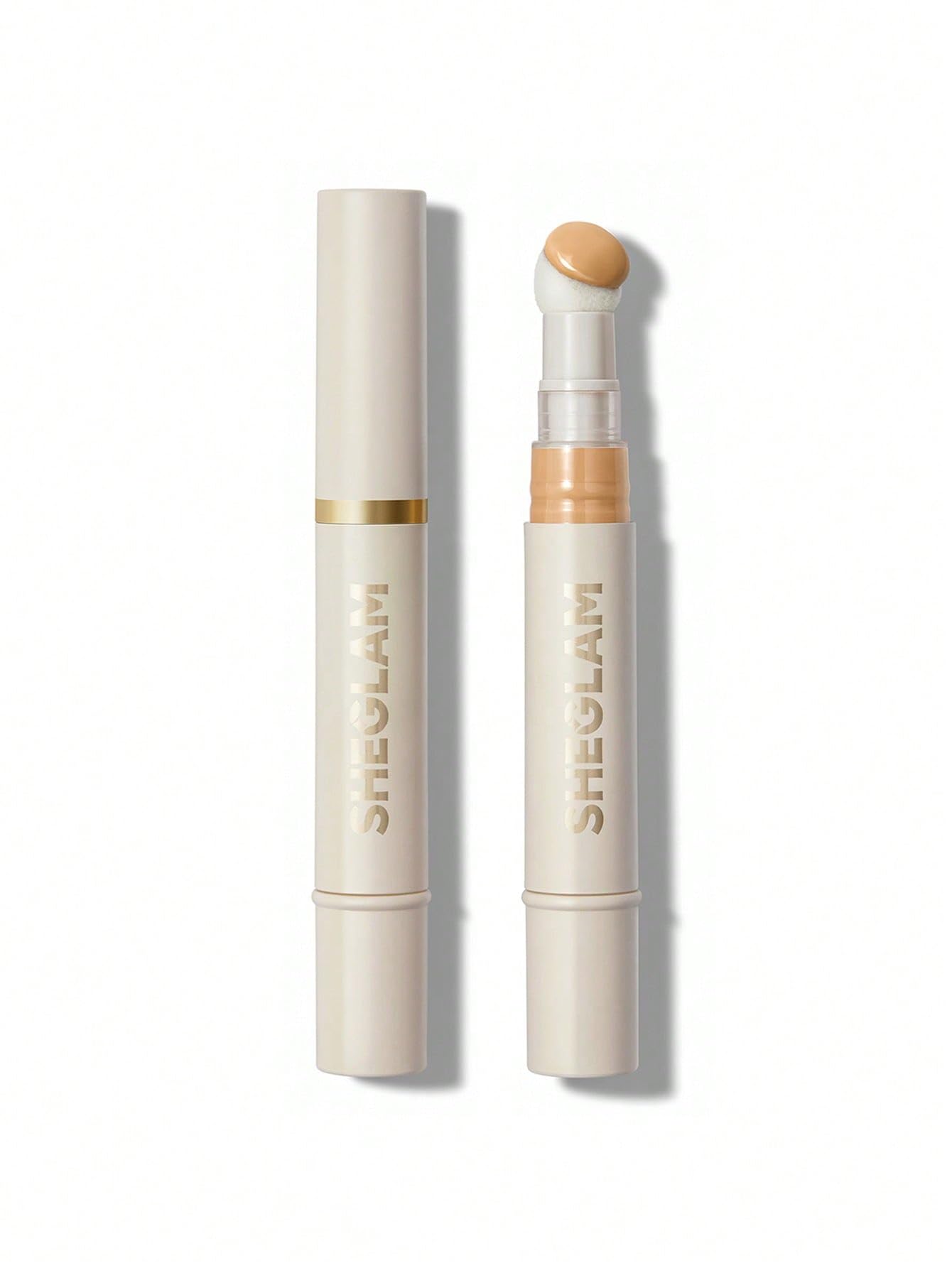 SHEGLAM concealer sponge-head closeup shows moisture-rich blending for natural coverage.