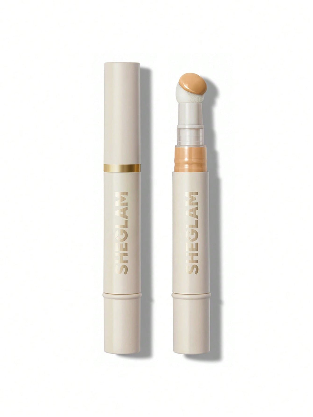 SHEGLAM concealer sponge-head closeup shows moisture-rich blending for natural coverage.