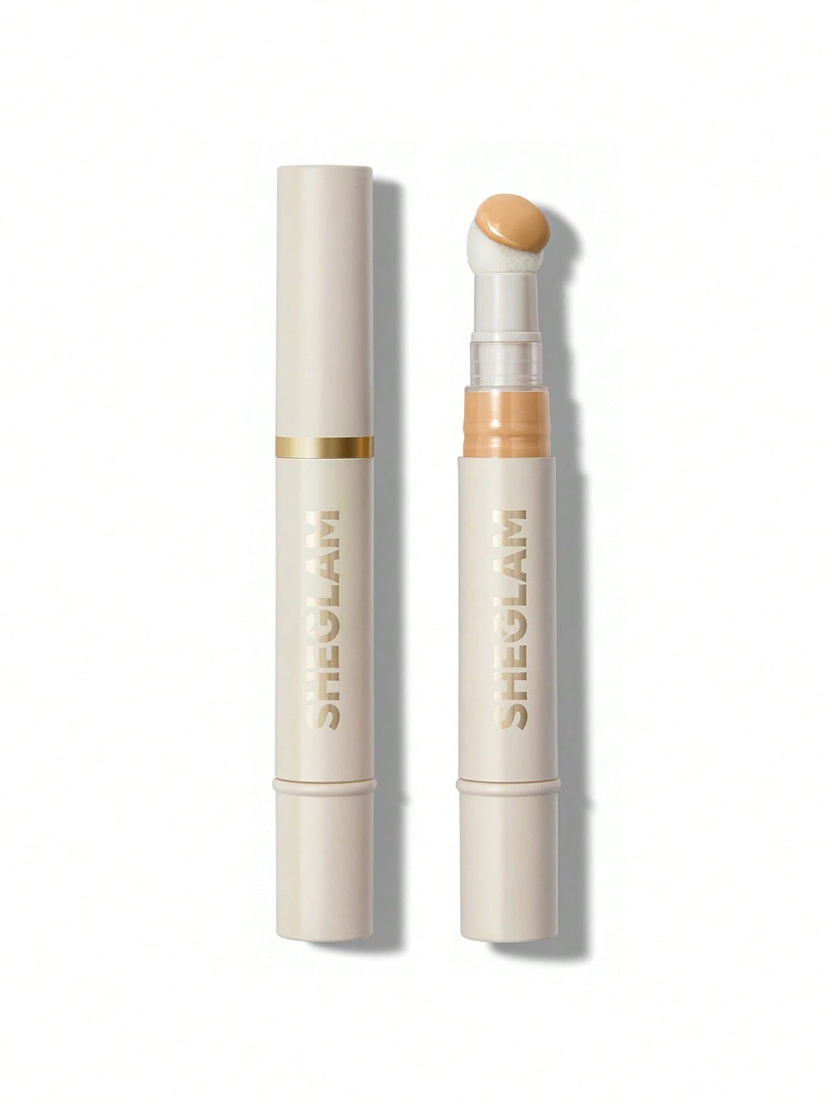 SHEGLAM concealer sponge-head closeup shows moisture-rich blending for natural coverage.