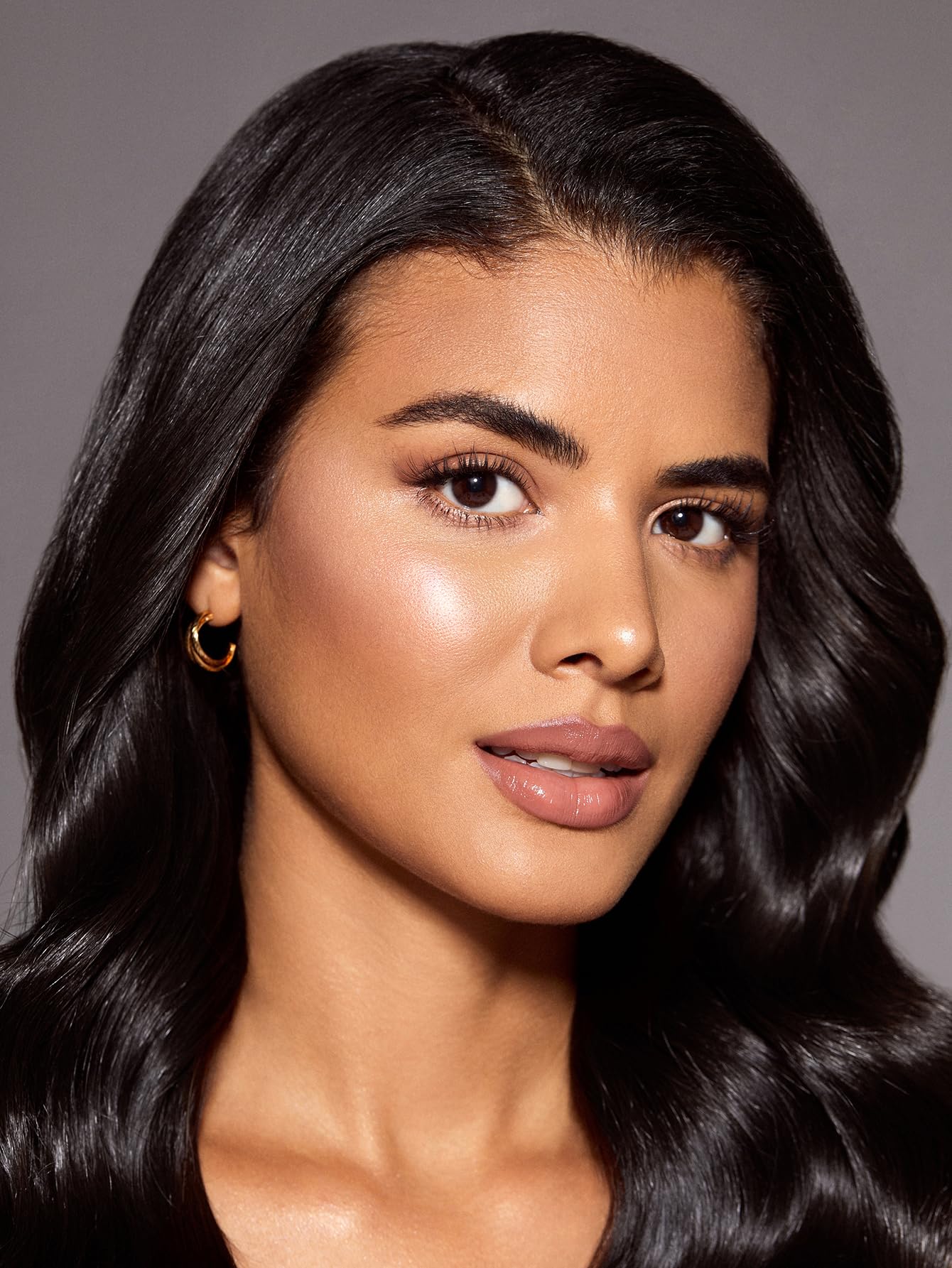 SHEGLAM highlighter on cheekbones Bellini Brunch provides natural lift and brightness