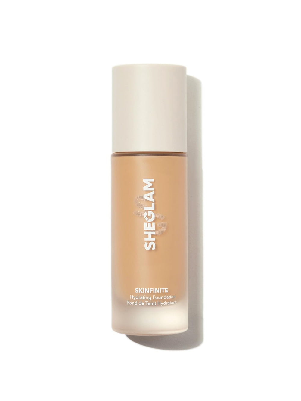SHEGLAM Skinfinite bottle closeup shows dewy, hydrating nude foundation finish.