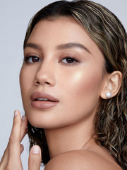 Sheglam Tea Cake highlighter on skin blends smoothly for natural focus.
