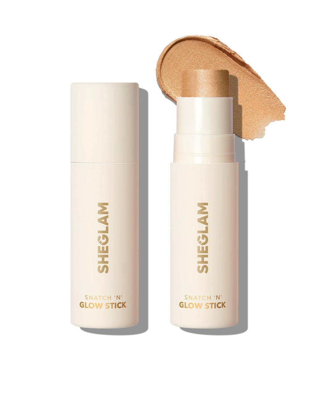 Sheglam Cream Highlighter Stick Tea Cake swatch shows soft luminous glow.