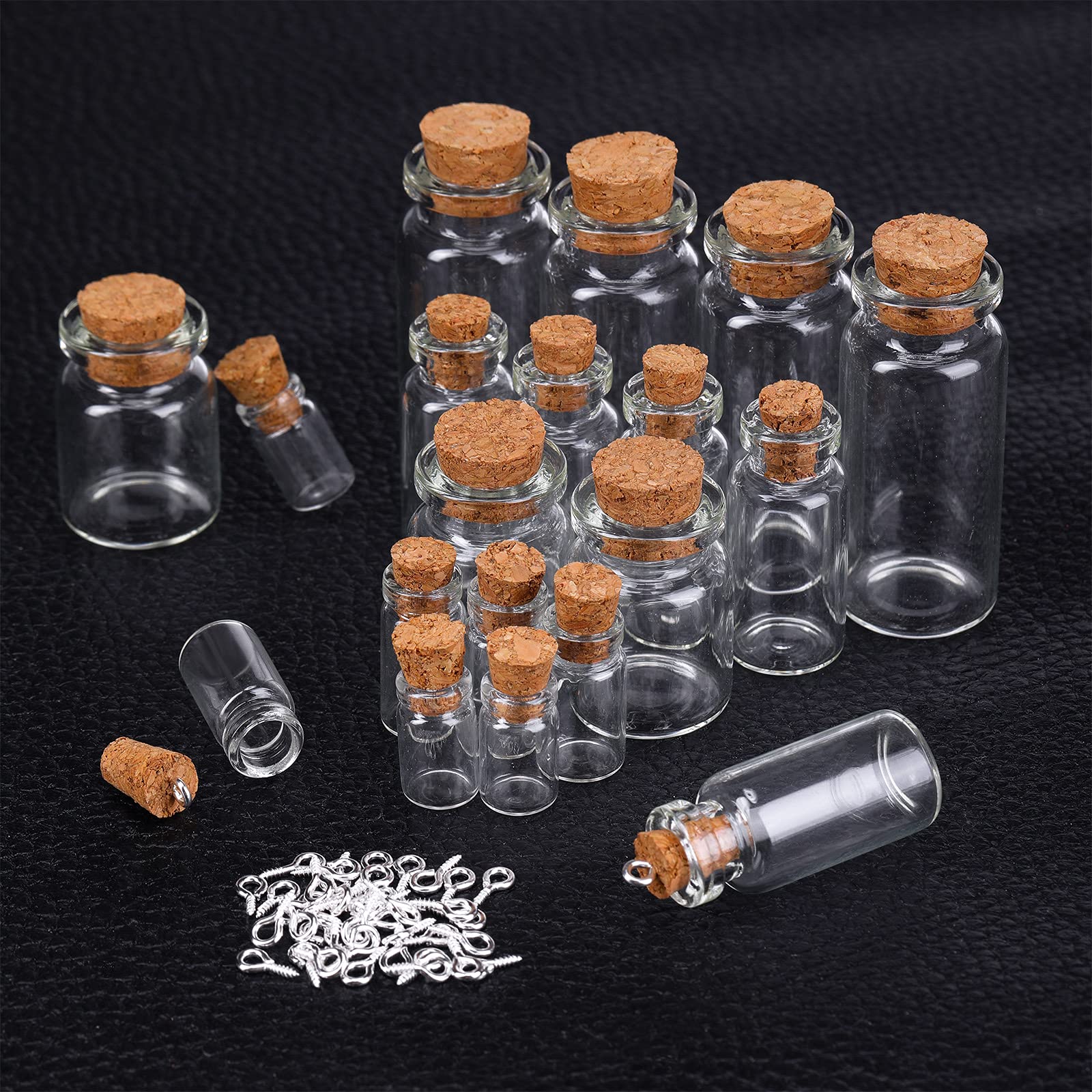 Sherli five-size clear glass bottles versatile for charms and treasures.
