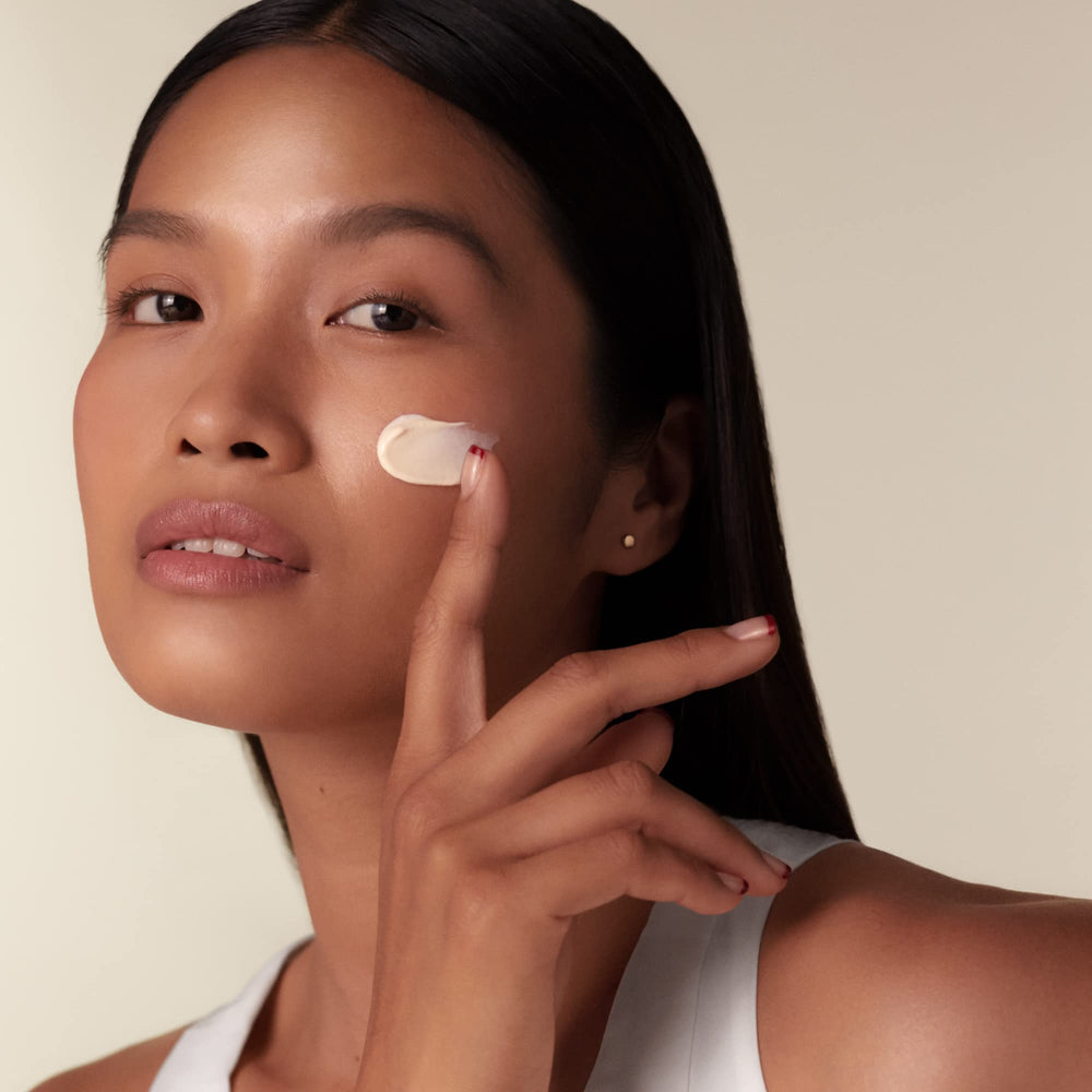 Shiseido Benefiance day cream jar lid off displaying creamy texture for daily use