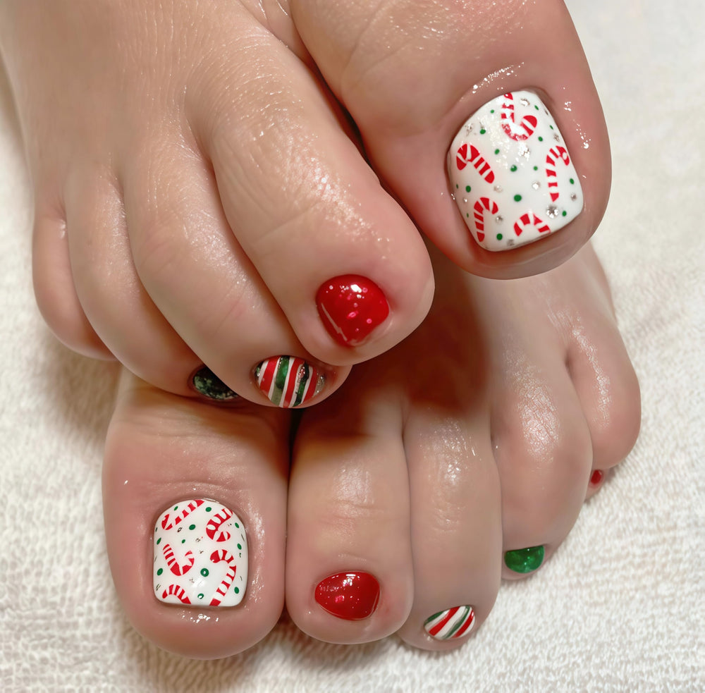 SHUXILIN Christmas candy cane toenails closeup for festive holiday style.