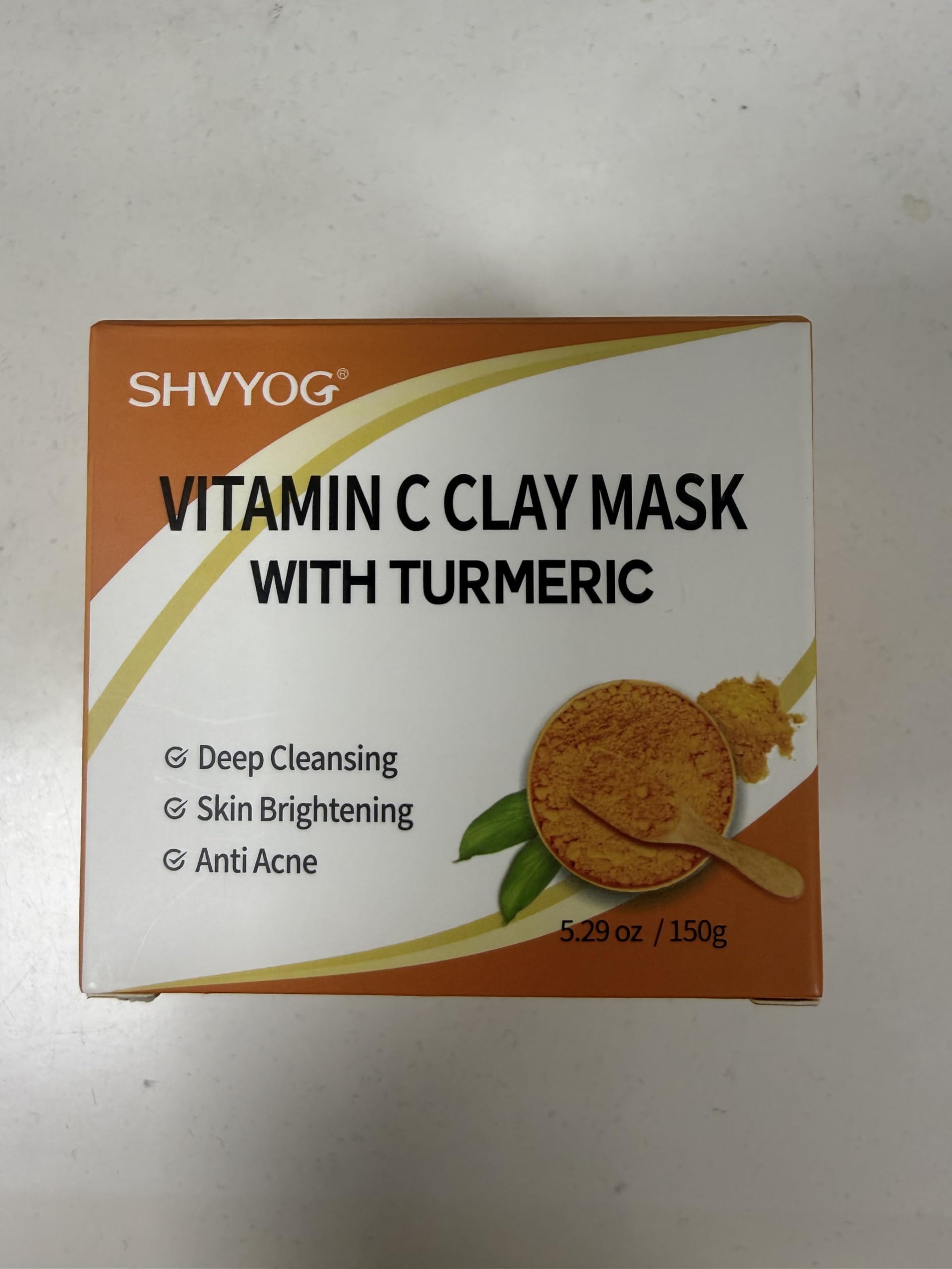 SHVYOG skincare routine setup with the mask and accessories.