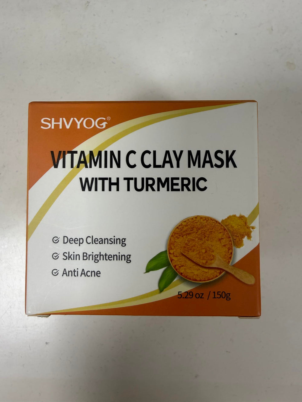 SHVYOG skincare routine setup with the mask and accessories.
