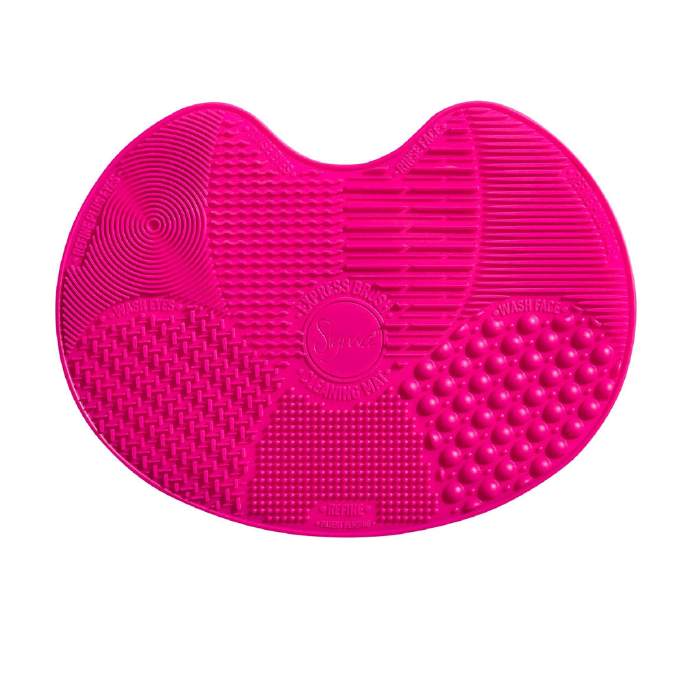 Sigma Beauty brush cleaner mat pink front view, compact travel-friendly solution for brushes.