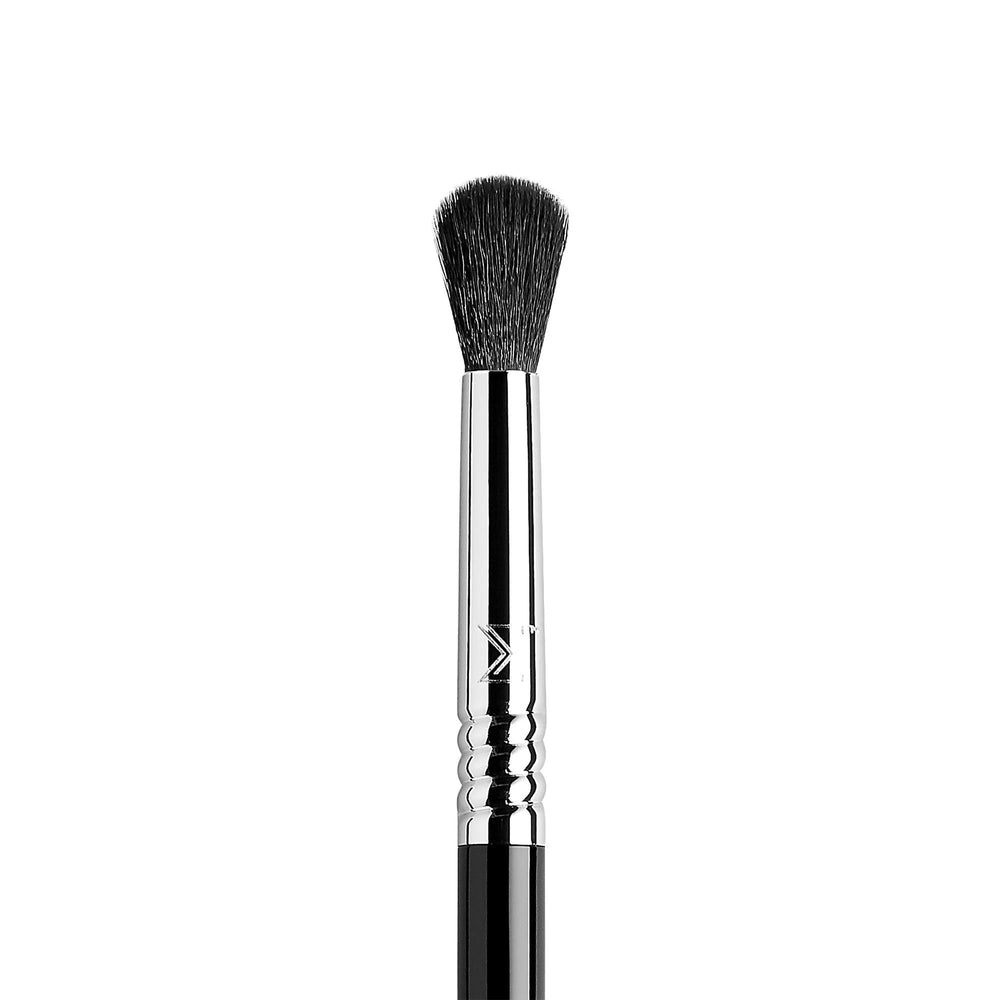 Sigma Beauty E38 blending brush on lid demonstrates precise pigment diffusion.