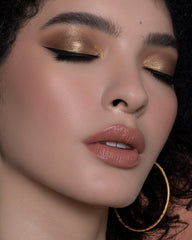 Sigma Beauty E38 professional-use brush shown in a studio setting.