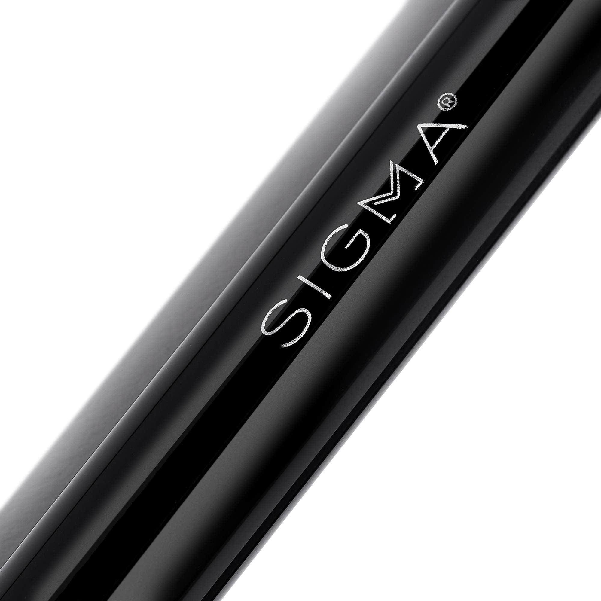 Sigma Beauty E55 brush applies cream eyeshadow for seamless lid coverage and control.
