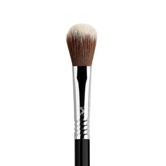 Sigma Beauty F03 highlighter brush fluffy yet firm head in action.