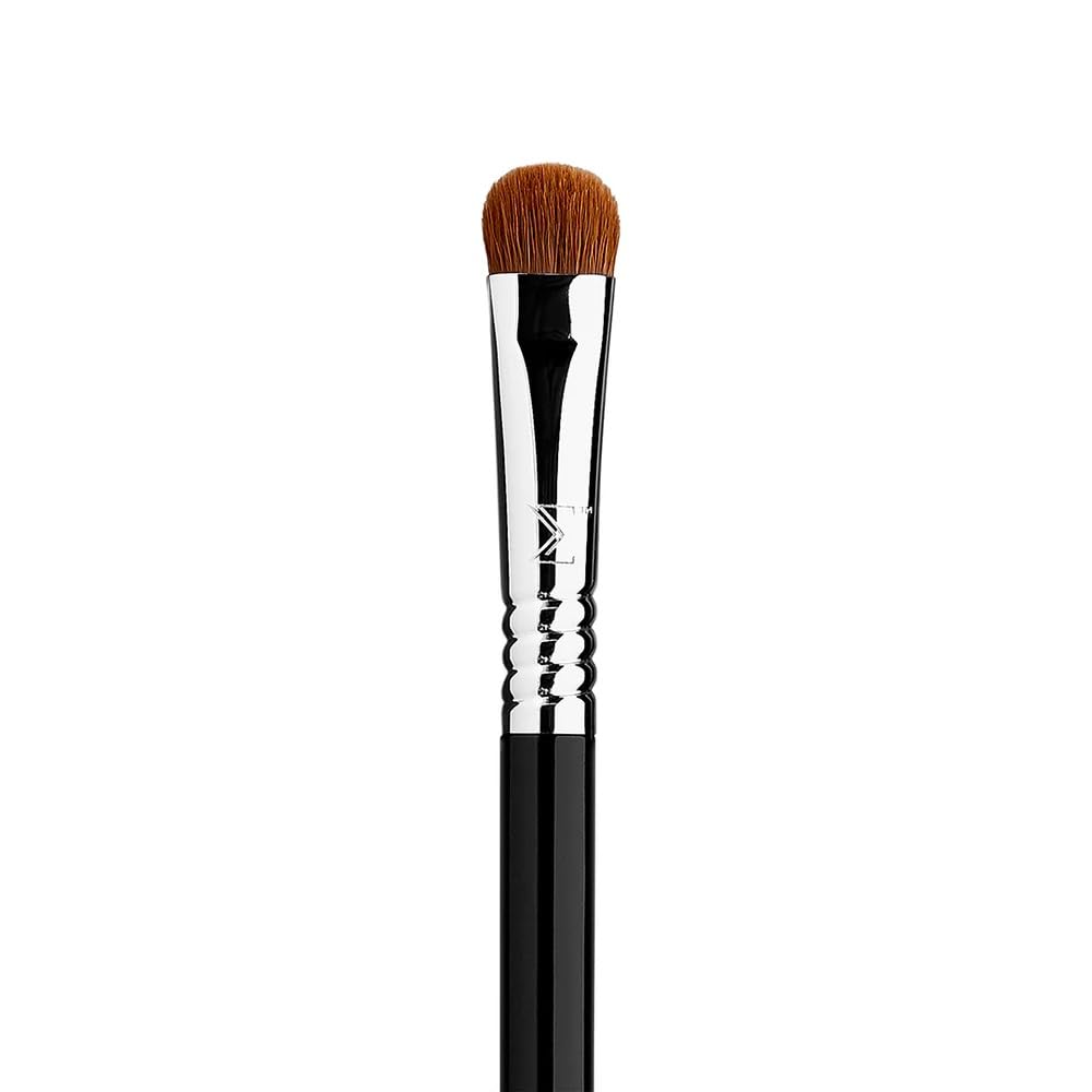 Sigma Beauty E55 eye shading brush close-up shows precise control for even base with cream or powder shadows.