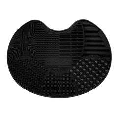 Sigma Spa Express mat top view showing compact travel-ready brush cleaner