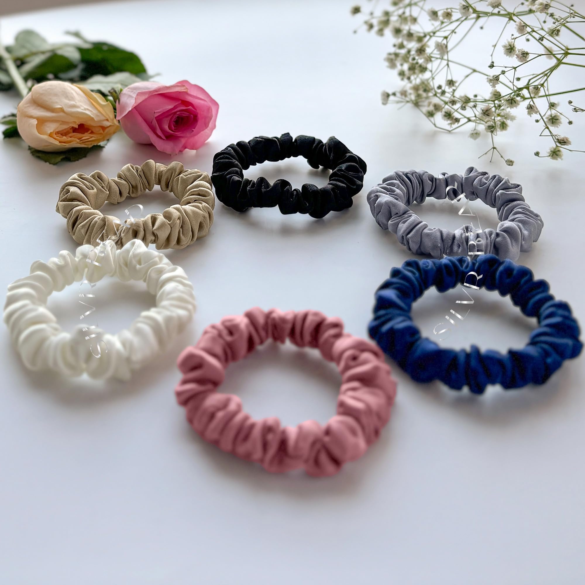 Silvr Bear black satin scrunchie as a versatile accessory for any look.