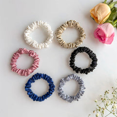 Silvr Bear ivory-white satin scrunchie with gentle glide for smooth styling.