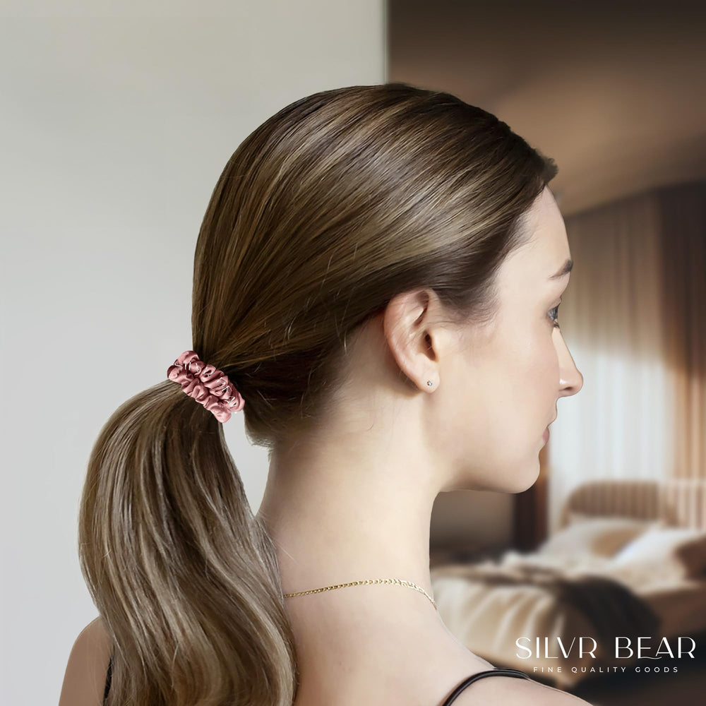 Silvr Bear navy-blue satin scrunchie offering durable hold for everyday hairstyles.
