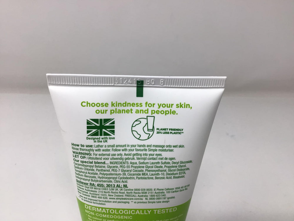 Simple Moisturizing Face Wash bottle pour—creamy lather ready for daily use.