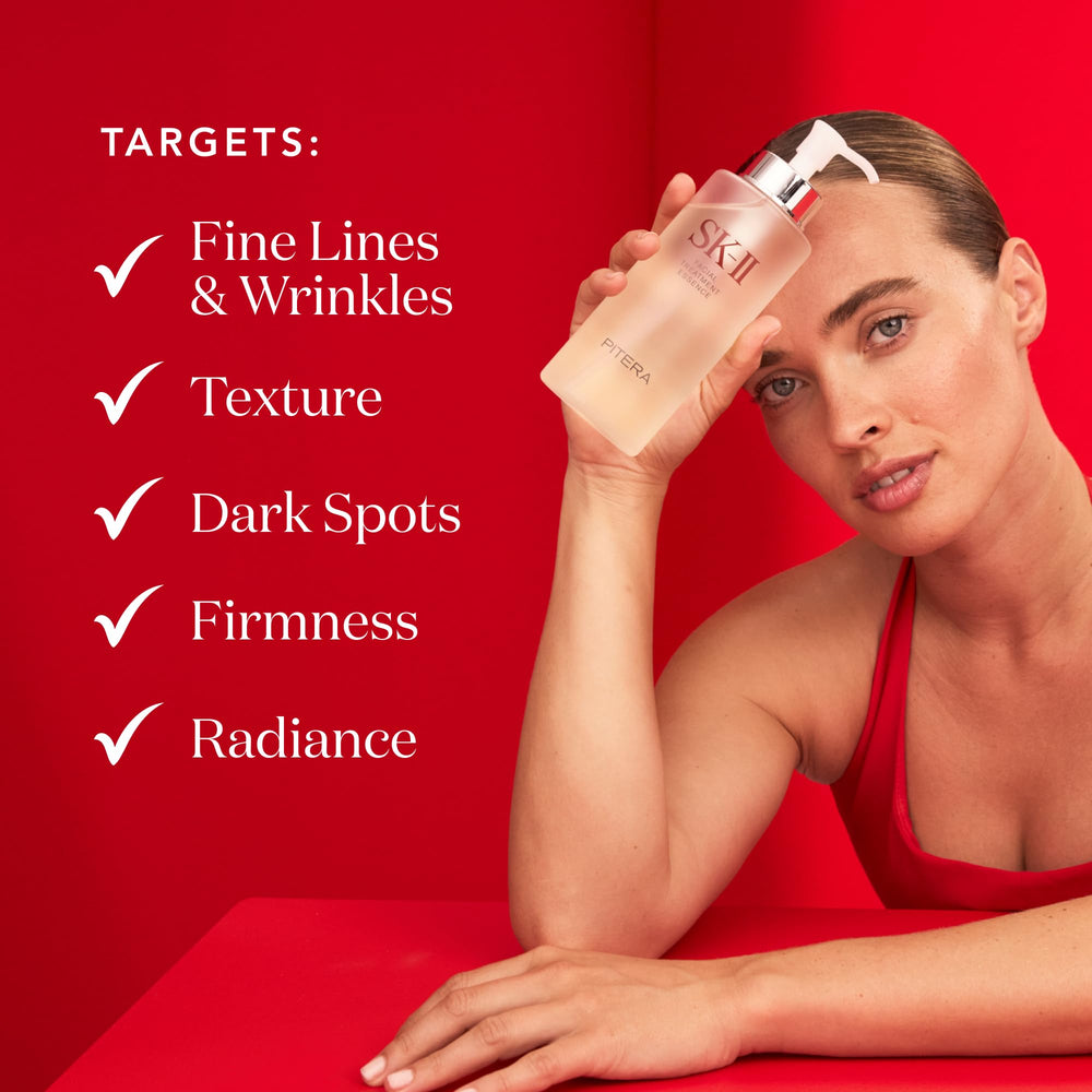 SK-II essence pressed onto face and neck to boost hydration.