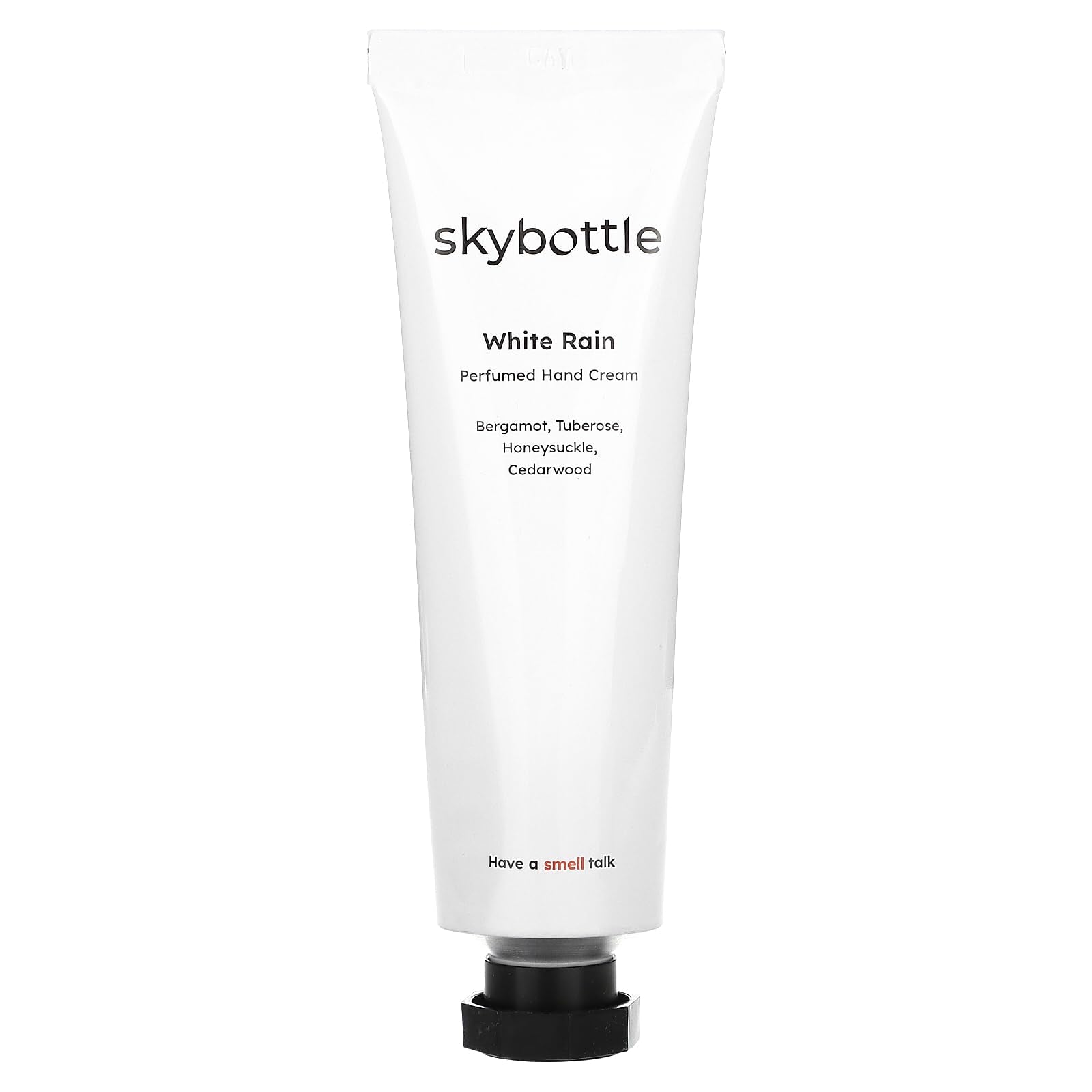 skybottle hand cream bottle close-up shows fig fruit scent and woody notes.