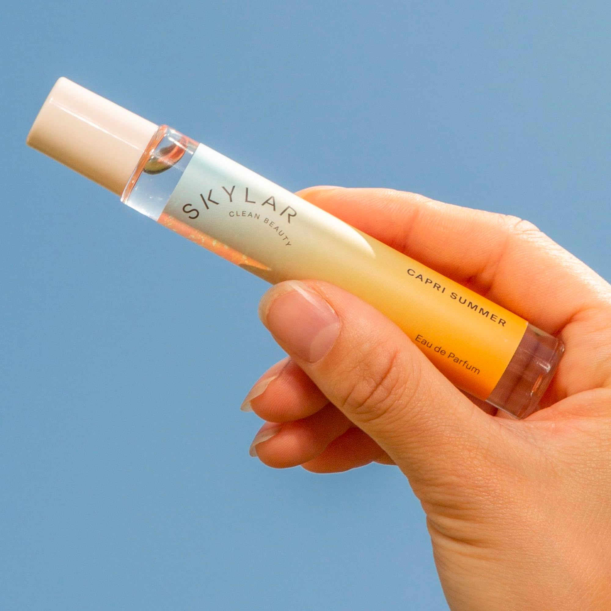Skylar Capri Summer top-notes image shows grapefruit, blood orange, bergamot for a bright mood.
