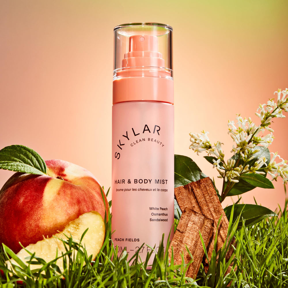 Skylar Peach Fields hair spritz in natural light for fruity-woody aroma.