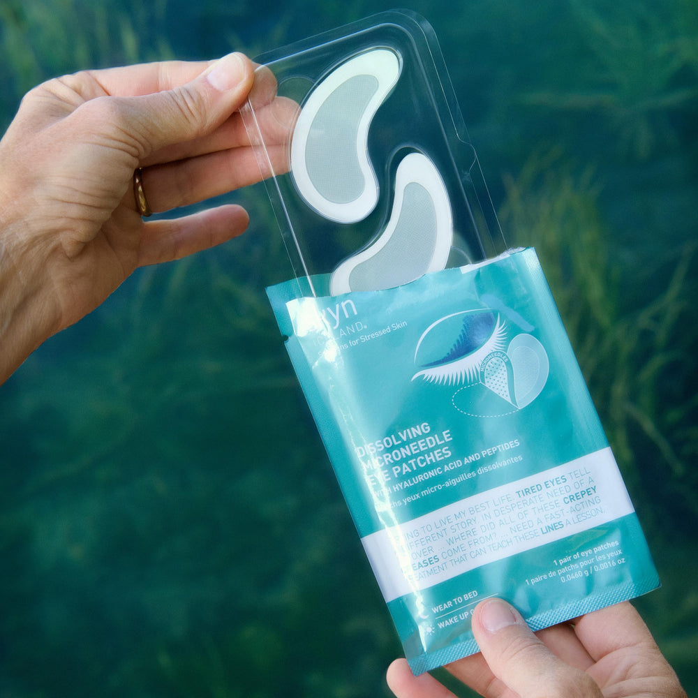 skyn ICELAND dissolving microneedle under eye patches on eye area; patch adheres and begins dissolving