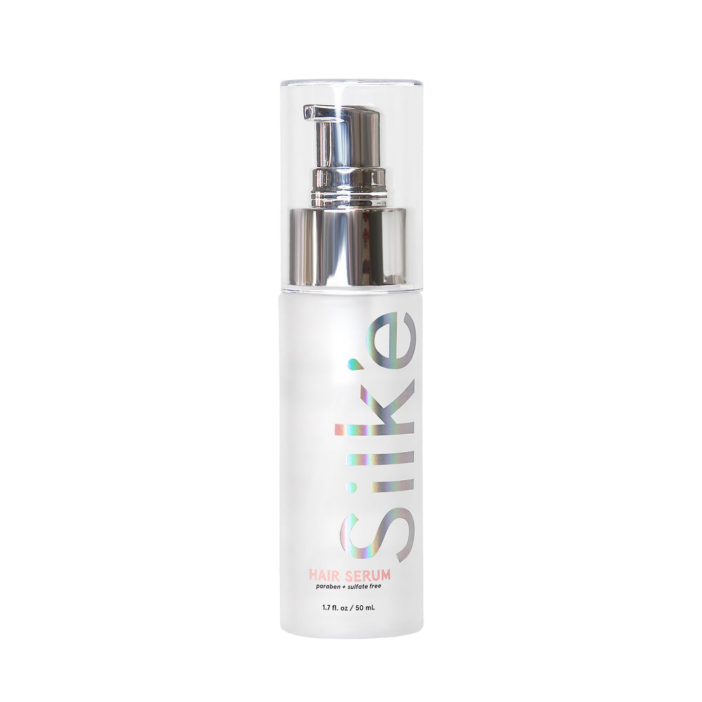 Sleek'e Silk'e Hair Serum bottle closeup for frizz control and silky shine.