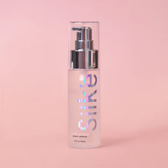 Sleek'e Silk'e Serum texture closeup highlighting nourishing lightweight feel.