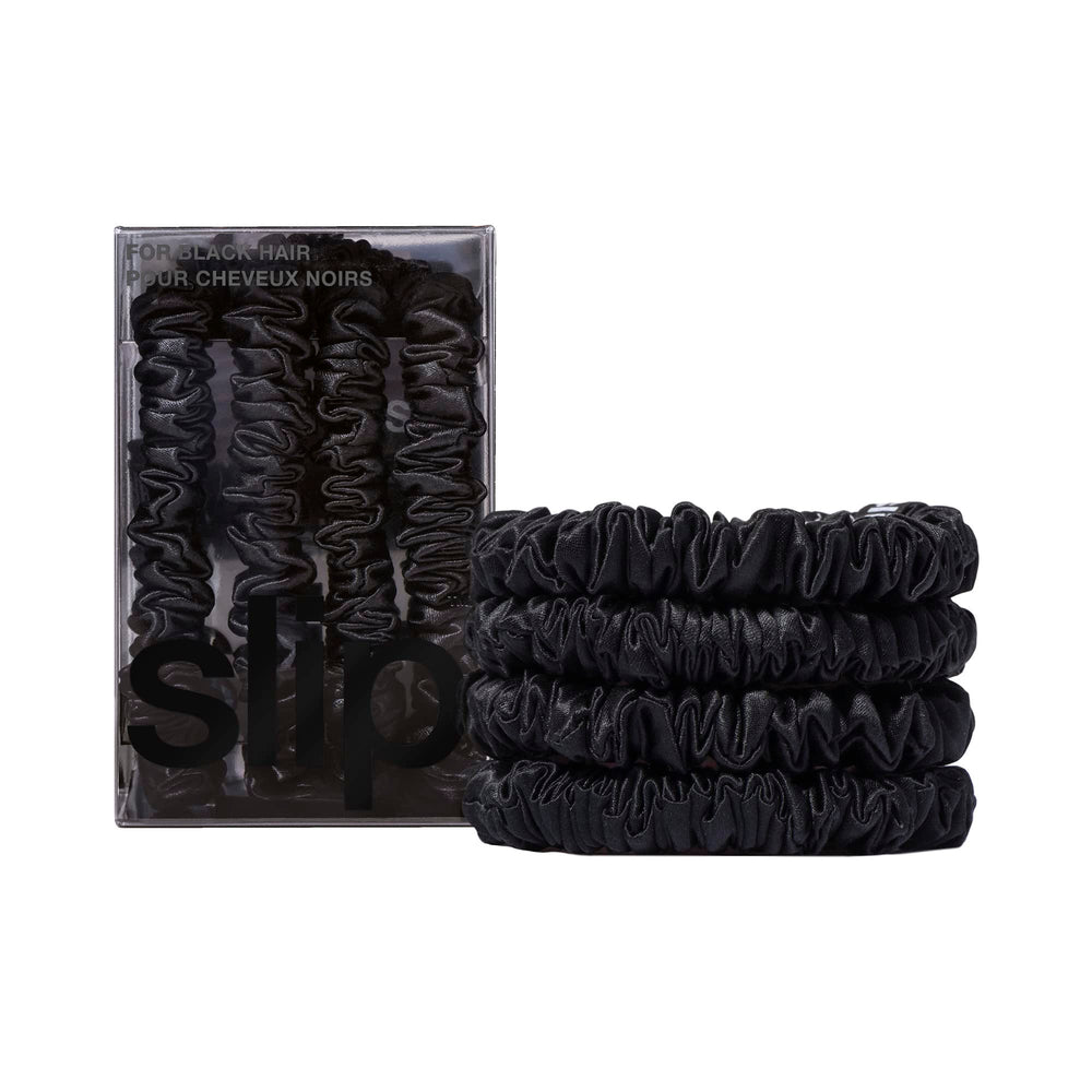 SLIP Silk Skinny Scrunchies Black set of four on flat lay for low-friction hair styling