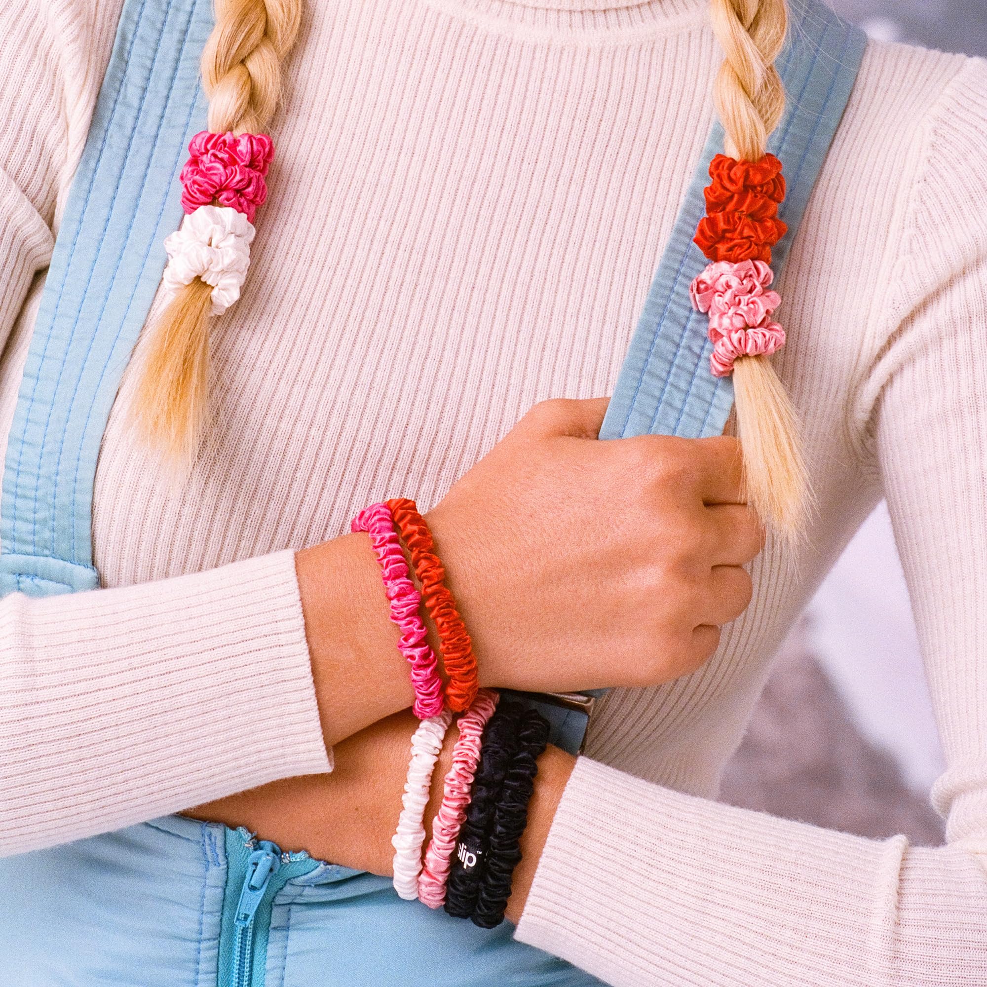 SLIP skinny scrunchies rose in holiday cracker packaging, glossy silk feel and gentle hold.