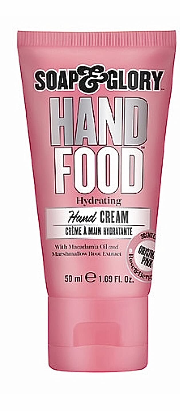 Soap & Glory hand cream application closeup with rich oils in action