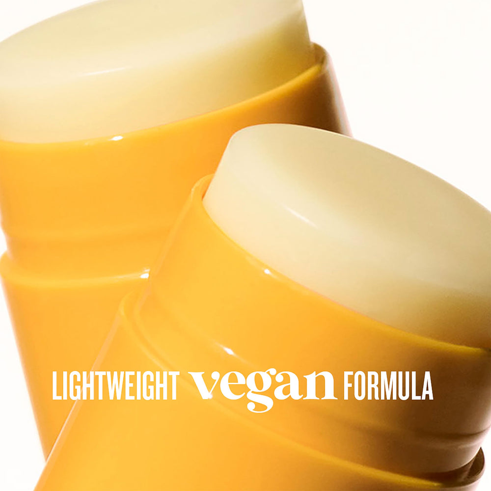 Sol de Janeiro lip butter closeup highlights creamy texture and dewy shine.